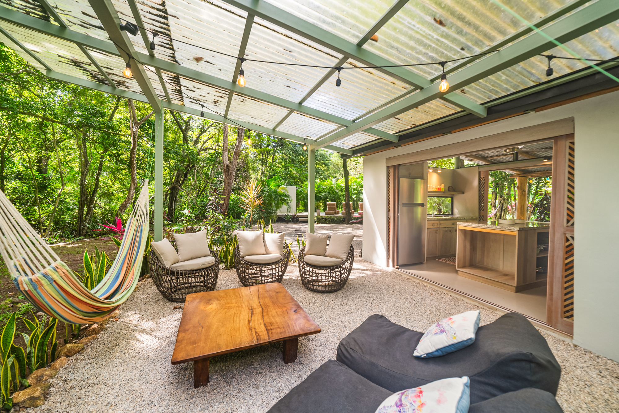 Covered outdoor lounge with colorful hammock